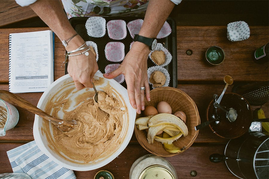 Woman in the kitchen cooking muffins